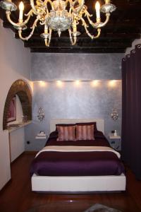 Un ou plusieurs lits dans un hébergement de l'établissement Domus31 - Luxury House in Trastevere