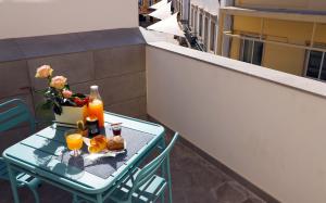 En balkong eller terrasse på Le Jardin Secret de Faro Guesthouse