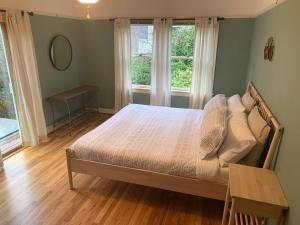 Voodi või voodid majutusasutuse Riverpath Inn toas