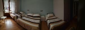 A bed or beds in a room at Hostal Campoamor