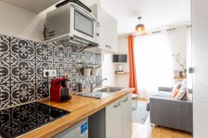 a kitchen with a sink and a counter top at Studio - Gabriel Peri in Montrouge
