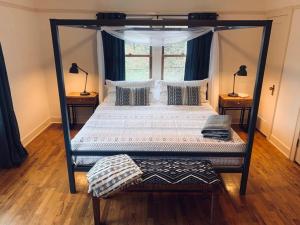 Voodi või voodid majutusasutuse Riverpath Inn toas