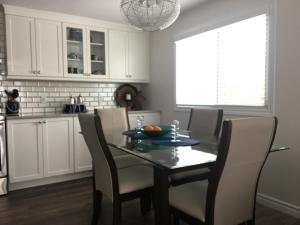 a kitchen with a dining room table and chairs at Hammer Haus II in Waterloo