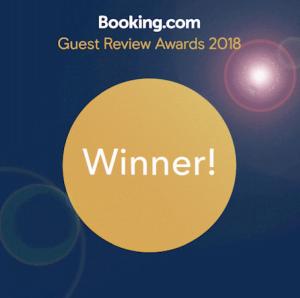 a yellow circle with the words guest review awards at Villas Tropical Los Corales Beach & Spa in Punta Cana