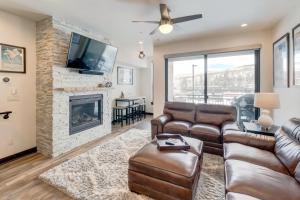 a living room with a couch and a fireplace at New Luxury Villa #268 With Rooftop Hot Tub & Great Views - 500 Dollars Of FREE Activities & Equipment Rentals Daily in Winter Park