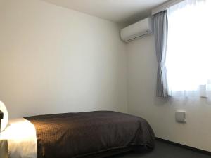 Voodi või voodid majutusasutuse Global Resort ONO de LUNE toas