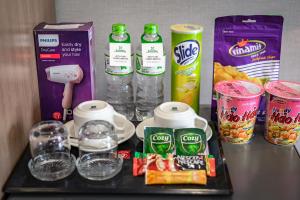 a tray with drinks and food on a table at Emerald Central in Ho Chi Minh City