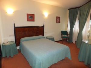 Postel nebo postele na pokoji v ubytování Hotel Canal
