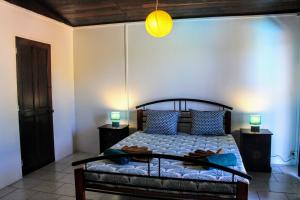 Una cama o camas en una habitación de TAHITI - Fare Temahana 12 fotos más