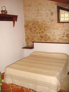 a bedroom with a bed in a room at Agroturisme Son Torrat in Petra