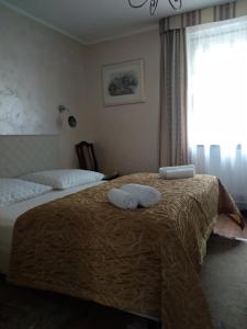 Łóżko lub łóżka w pokoju w obiekcie Villa Almira