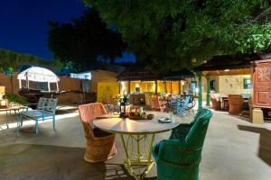 a patio with a table and chairs on a patio at Karni Bhawan Heritage Hotel Jodhpur in Jodhpur