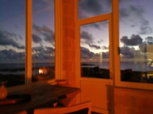 a room with a window with a view of the ocean at Elafonisi Villa above the Beach in Elafonisi