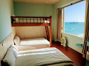 Postel nebo postele na pokoji v ubytování Ocean B&B