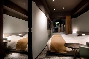 Tempat tidur dalam kamar di Kobe Plaza Hotel West
