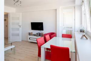 a living room filled with furniture and a tv at bonApartments in Warsaw