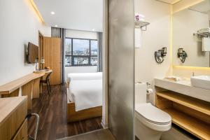 Phòng tắm tại Magnolia Hotel