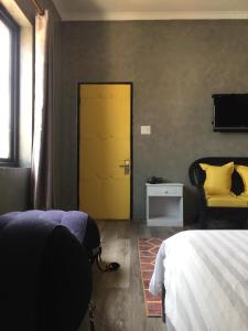 Postel nebo postele na pokoji v ubytování Dylan Hotel