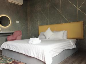 Postel nebo postele na pokoji v ubytování Dylan Hotel