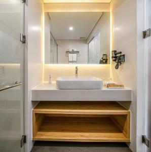 Phòng tắm tại Magnolia Hotel