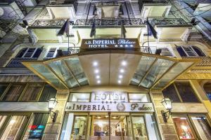 a store front of a building with a sign on it at Imperial Palace Classical Hotel Thessaloniki in Thessaloniki