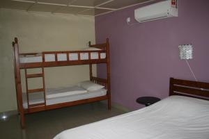 Postel nebo postele na pokoji v ubytování Balai Serama Guesthouse