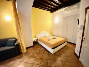 Ένα ή περισσότερα κρεβάτια σε δωμάτιο στο SWEETSUITE Rome