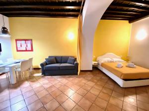 Ένα ή περισσότερα κρεβάτια σε δωμάτιο στο SWEETSUITE Rome