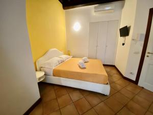 Ένα ή περισσότερα κρεβάτια σε δωμάτιο στο SWEETSUITE Rome