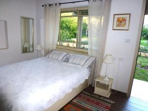 Ένα ή περισσότερα κρεβάτια σε δωμάτιο στο Rothschild Galilee Hospitality
