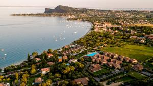 an aerial view of a town next to the water at Onda Blu Resort in Manerba del Garda