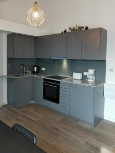 Kuchyň nebo kuchyňský kout v ubytování Sissi Apartments