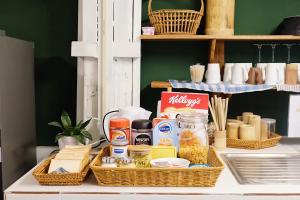 a shelf with two baskets of food on a counter at Barn Laos Hostel in Vientiane