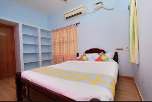 Postel nebo postele na pokoji v ubytování vanitha villa