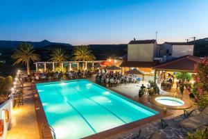 an overhead view of a swimming pool at a hotel at Castri Village Hotel in Palekastron