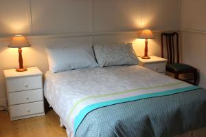 En eller flere senge i et værelse på The Old Cottage @ Cowes