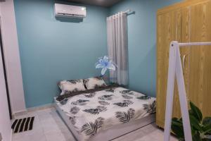 Giường trong phòng chung tại LY'S Căn hộ Homestay Phan Rang-2pn