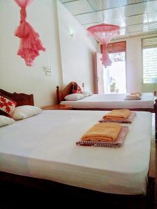 Postel nebo postele na pokoji v ubytování Margosa Guesthouse