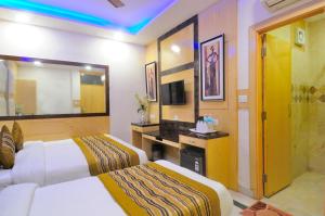 Postel nebo postele na pokoji v ubytování Hotel Karlo Kastle - Paharganj - New Delhi