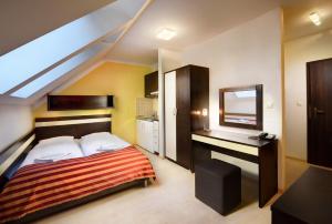 Letto o letti in una camera di Hotel Bešeňová