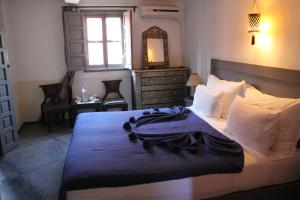 Postel nebo postele na pokoji v ubytování Riad 64 Maison D'hôtes & Spa