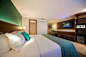 Ένα ή περισσότερα κρεβάτια σε δωμάτιο στο Radisson Hotel Belém