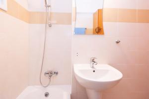 a bathroom with a sink and a shower at Olympia flat 201 in Larnaca