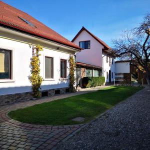 a house with a green lawn in front of it at NEUSTADT Villa in Cristian