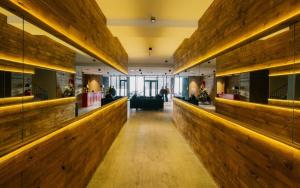 a lobby of a building with wooden walls at New Gudauri Suites by Gudauri Travel in Gudauri