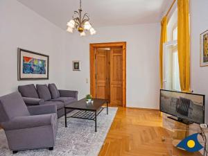 a living room with a couch and a table at Villa Linde Whg 06 in Heringsdorf