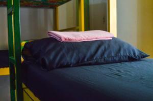 a pillow sitting on top of a bunk bed at Lapa Casa Hostel in Rio de Janeiro