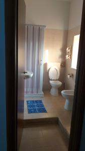 a bathroom with a shower and a toilet and a sink at I Giardini Di Eidos in Sant'Agata de' Goti +45 photos