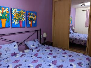 En eller flere senger på et rom på Apartamento zona residencial Montesol