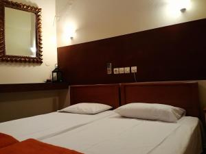 Postel nebo postele na pokoji v ubytování Efstratios Hotel